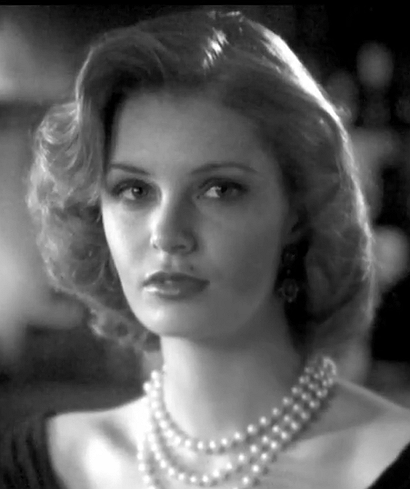 Helen — black and white portrait of a woman with styled hair and pearls