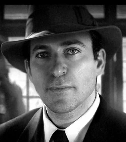 Sam — black and white portrait of a man wearing a fedora and suit